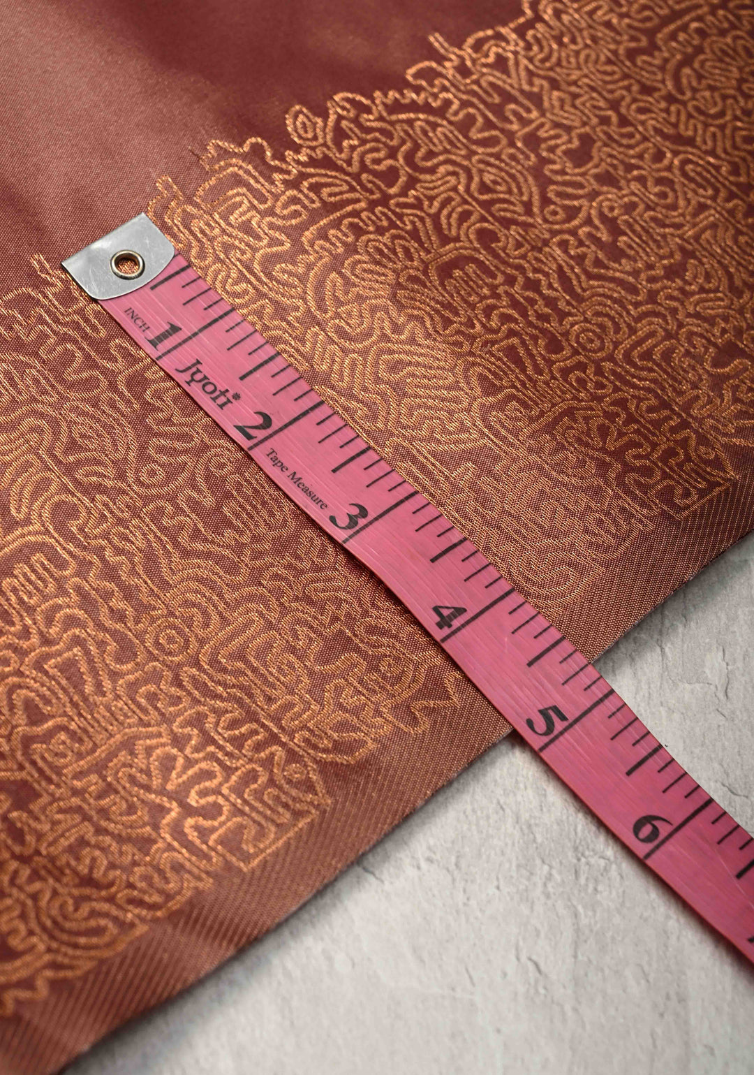 Copper Rose Kanchi Semi Silk Saree with Geometric Buttas and Abstract Zari Border