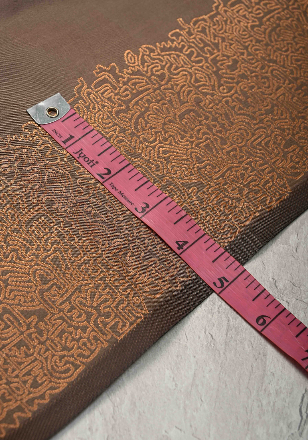 Brown Kanchi Semi Silk Saree with Geometric Buttas and Abstract Zari Border