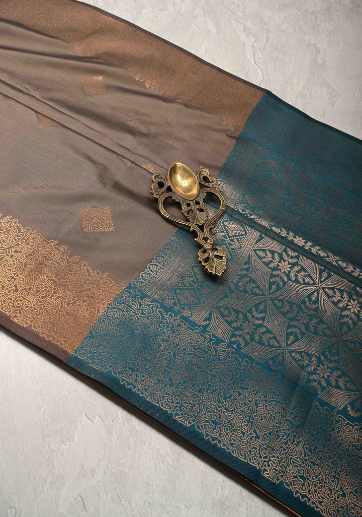 Brown Kanchi Semi Silk Saree with Geometric Buttas and Abstract Zari Border
