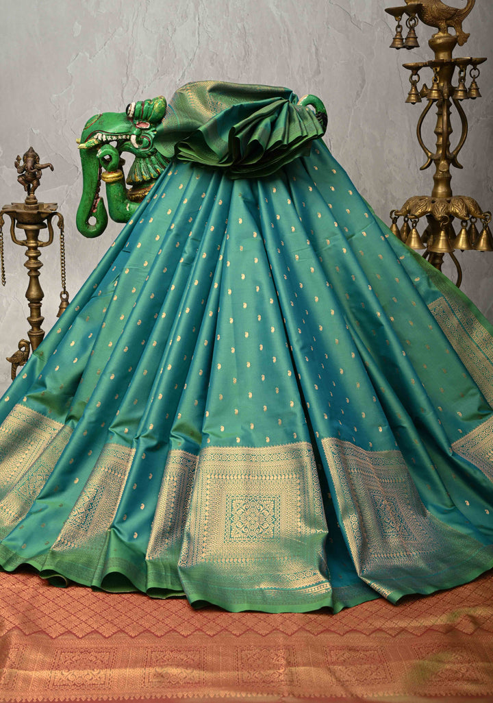Green Dual tone Kanchi Semi Silk Saree with Paisley Zari Buttas and Geomatric Motifs on Border