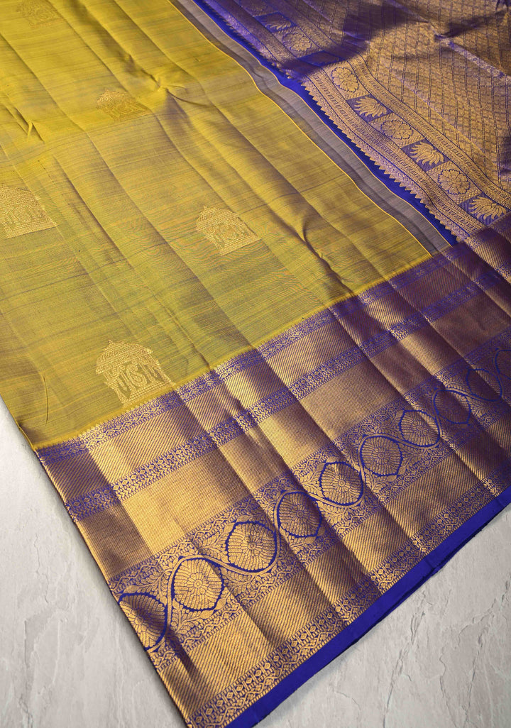 1 Gram Gold Zari Moss Green-Purple Dual tone Pure Kanjivaram Silk Saree with Arch Motifs and Wide Zari Border | SILK MARK CERTIFIED