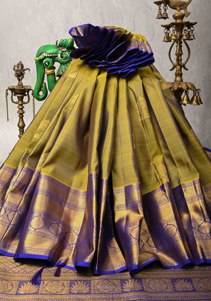 1 Gram Gold Zari Moss Green-Purple Dual tone Pure Kanjivaram Silk Saree with Arch Motifs and Wide Zari Border | SILK MARK CERTIFIED