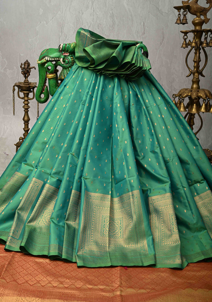 Dark Mint Green Dual tone Kanchi Semi Silk Saree with Paisley Zari Buttas and Geomatric Motifs on Border