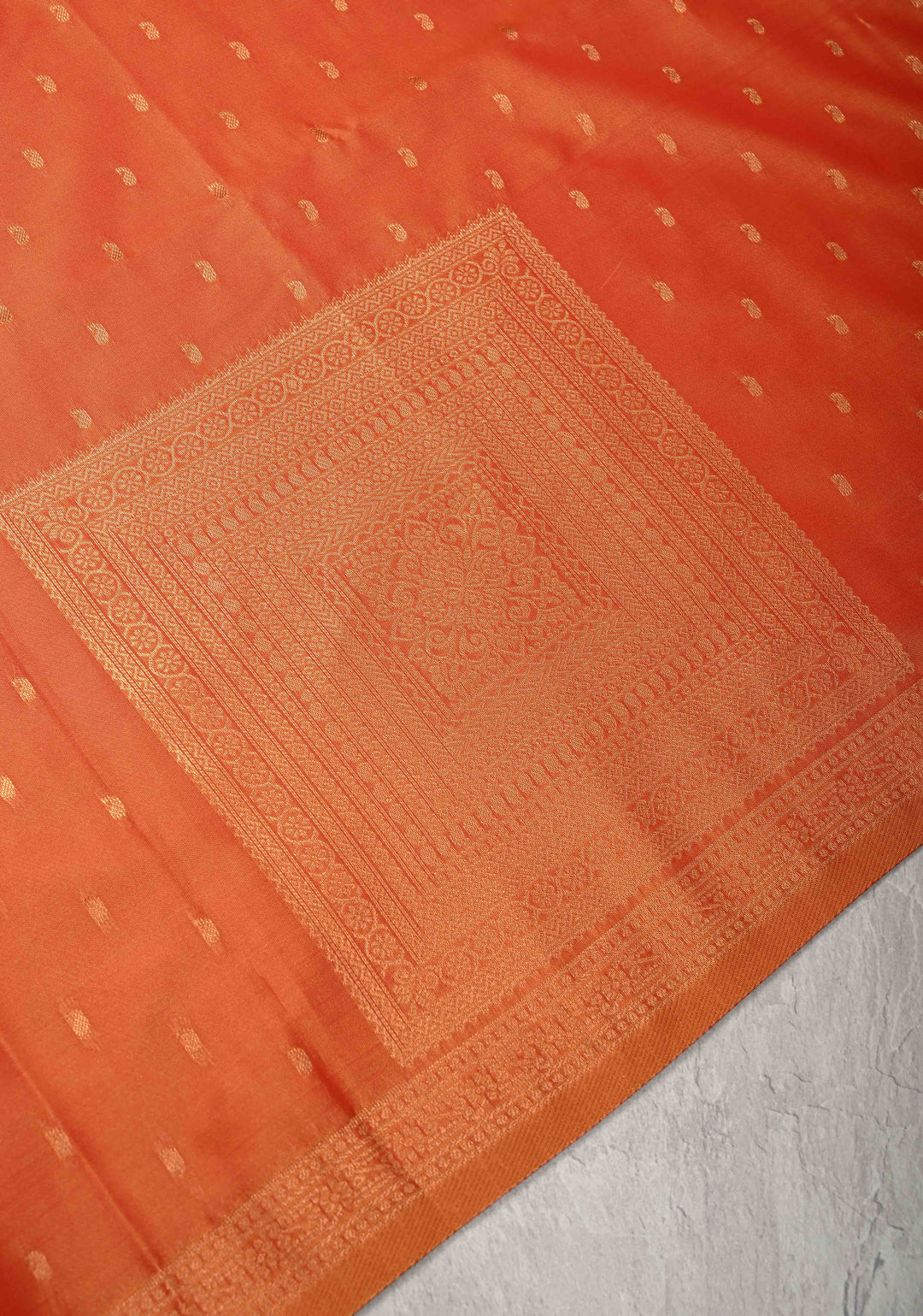 Orange Kanchi Semi Silk Saree with Paisley Zari Buttas and Geomatric Motifs on Border
