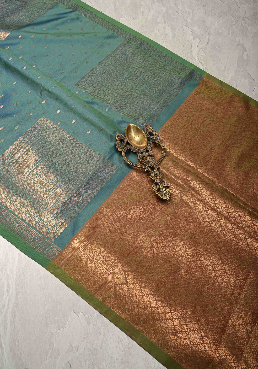 Peacock Blue Dual tone Kanchi Semi Silk Saree with Paisley Zari Buttas and Geomatric Motifs on Border
