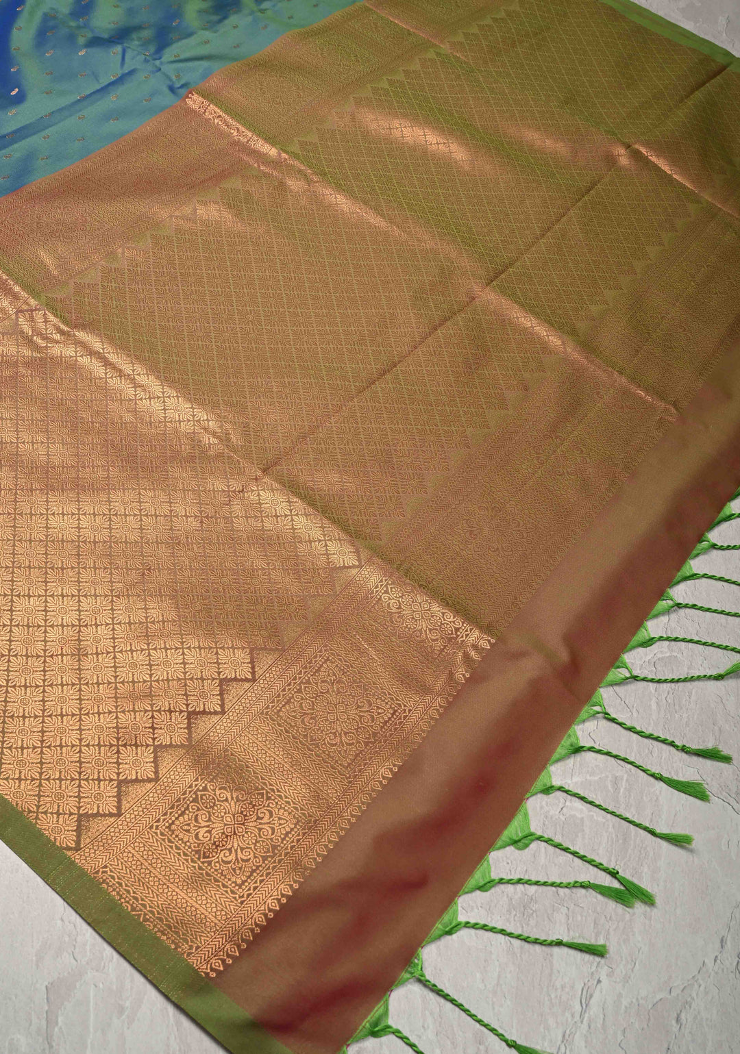 Peacock Blue Dual tone Kanchi Semi Silk Saree with Paisley Zari Buttas and Geomatric Motifs on Border