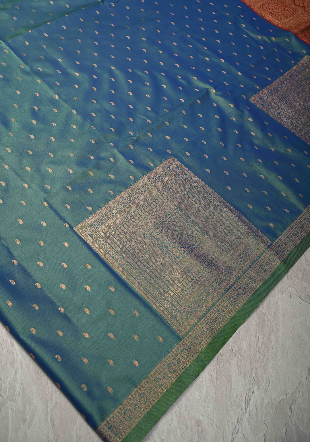Peacock Blue Dual tone Kanchi Semi Silk Saree with Paisley Zari Buttas and Geomatric Motifs on Border