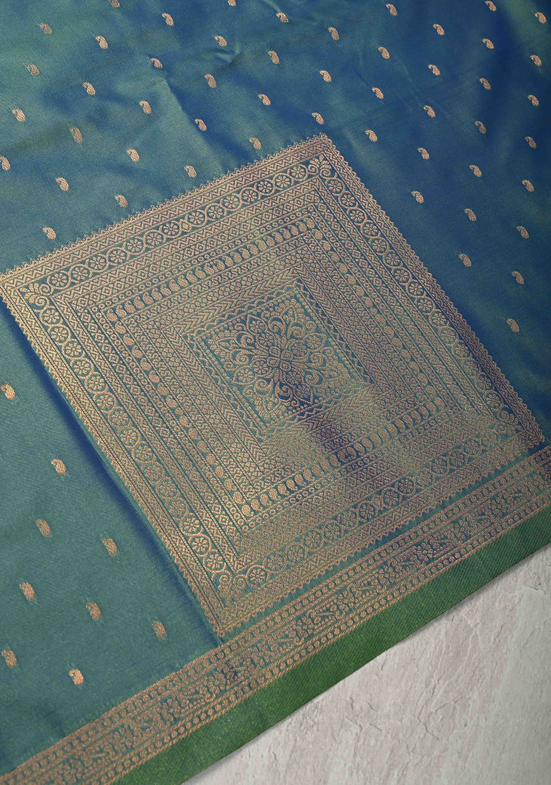 Peacock Blue Dual tone Kanchi Semi Silk Saree with Paisley Zari Buttas and Geomatric Motifs on Border
