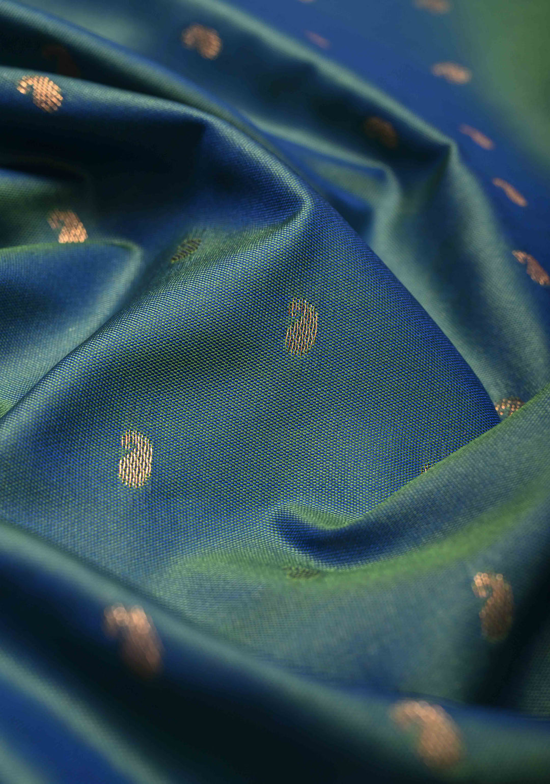Peacock Blue Dual tone Kanchi Semi Silk Saree with Paisley Zari Buttas and Geomatric Motifs on Border