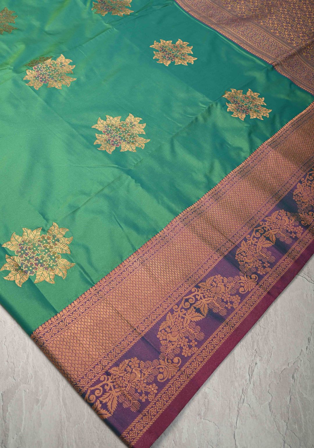 Parrot Green Kanchi Semi Silk Saree with Floral Meenakari Buttas and Contrst Zari Border