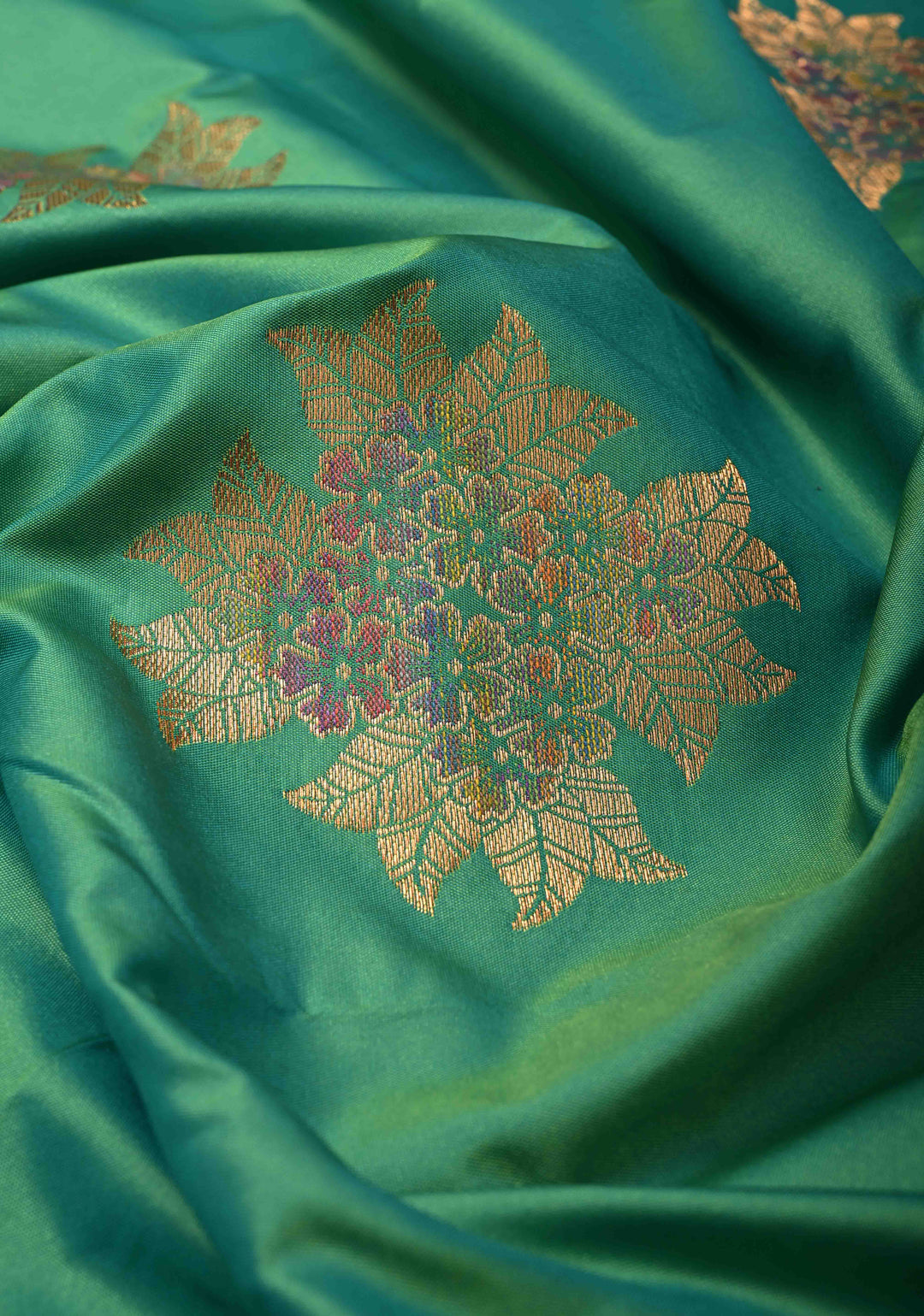 Parrot Green Kanchi Semi Silk Saree with Floral Meenakari Buttas and Contrst Zari Border