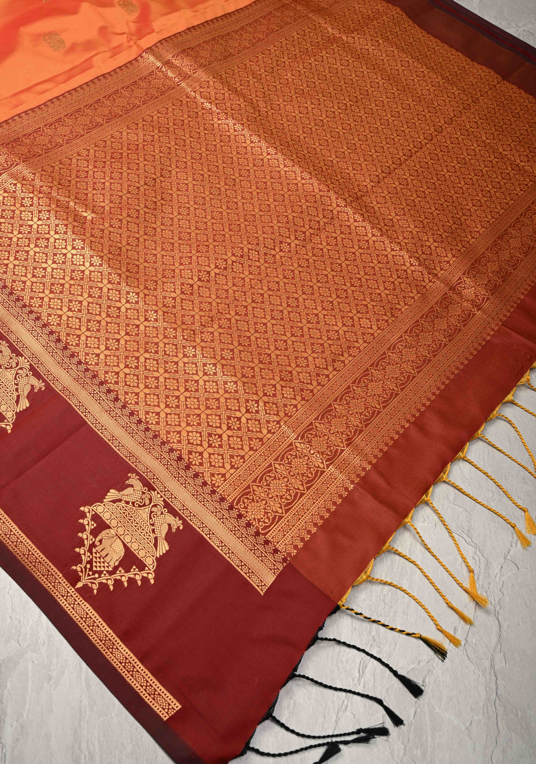 Orange Kanchi Semi Silk Saree with Elephant-Peacock Buttas and Distinct Motif Contrast Zari Border