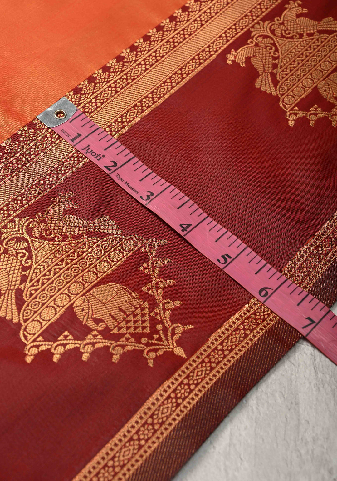 Orange Kanchi Semi Silk Saree with Elephant-Peacock Buttas and Distinct Motif Contrast Zari Border