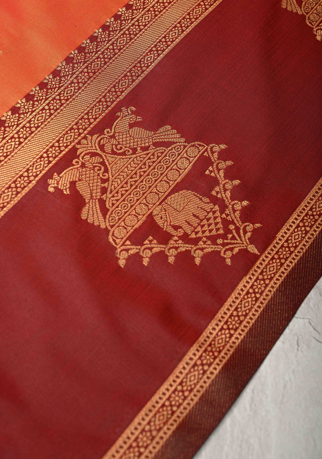 Orange Kanchi Semi Silk Saree with Elephant-Peacock Buttas and Distinct Motif Contrast Zari Border