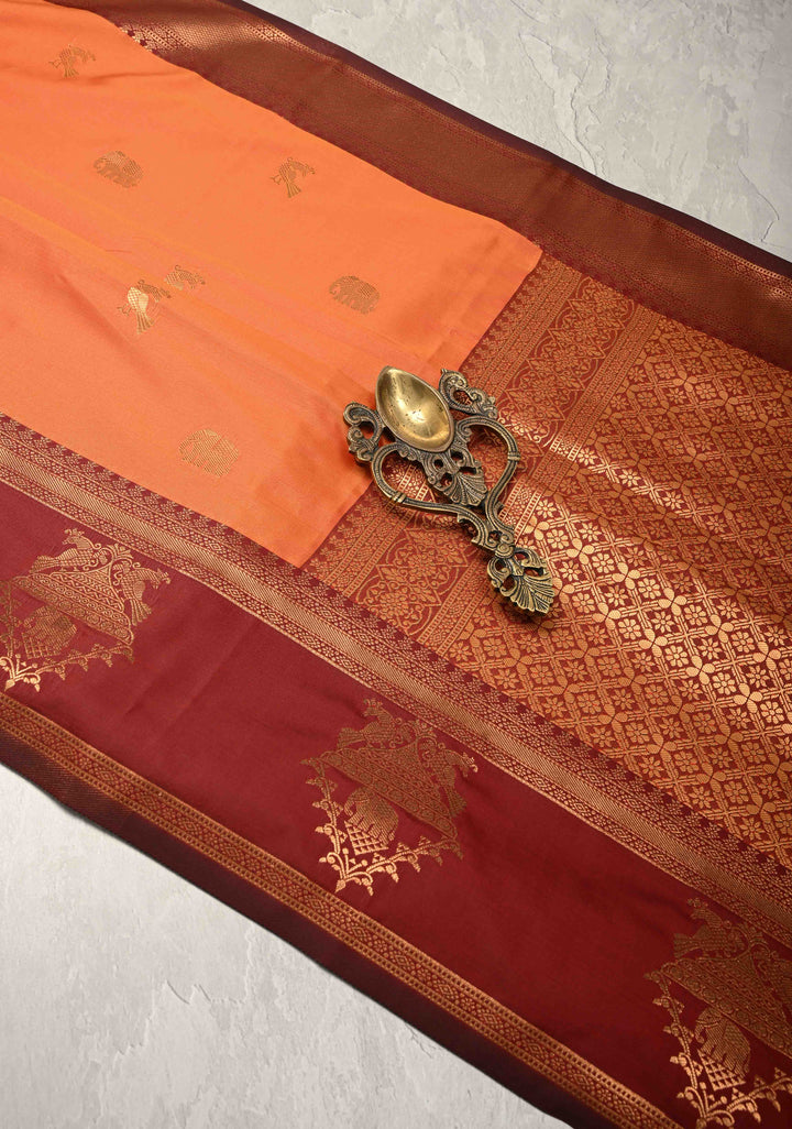 Orange Kanchi Semi Silk Saree with Elephant-Peacock Buttas and Distinct Motif Contrast Zari Border