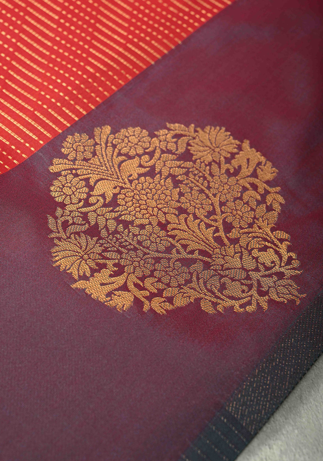 Red Vertical Zari Stripes on Kanchi Semi Silk Saree with Floral Buttas and Distinct Motifs on Contrast Border