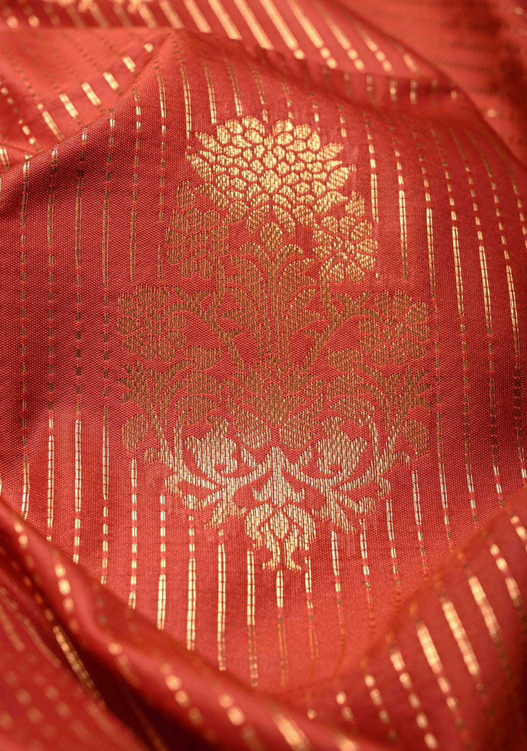 Vermilion Red Vertical Zari Stripes on Kanchi Semi Silk Saree with Floral Buttas and Distinct Motifs on Contrast Border