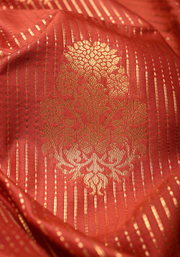 Vermilion Red Vertical Zari Stripes on Kanchi Semi Silk Saree with Floral Buttas and Distinct Motifs on Contrast Border