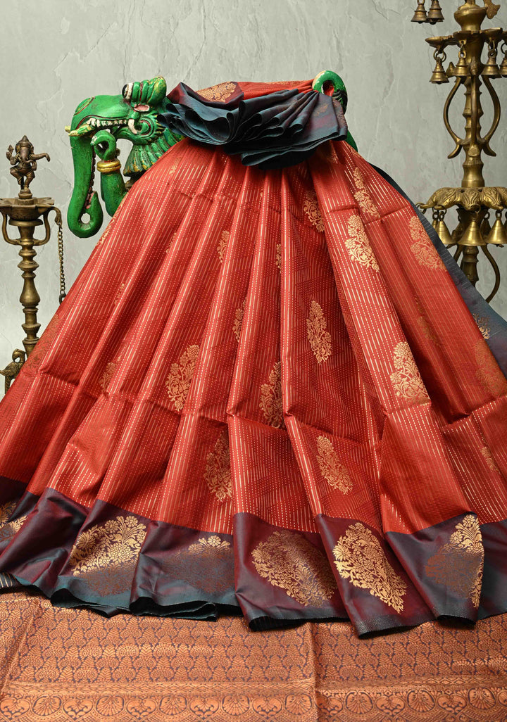 Vermilion Red Vertical Zari Stripes on Kanchi Semi Silk Saree with Floral Buttas and Distinct Motifs on Contrast Border