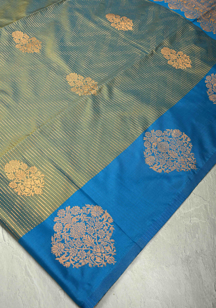 Sage Green-Blue Dual tone Vertical Zari Stripes on Kanchi Semi Silk Saree with Floral Buttas and Distinct Motifs on Contrast Border