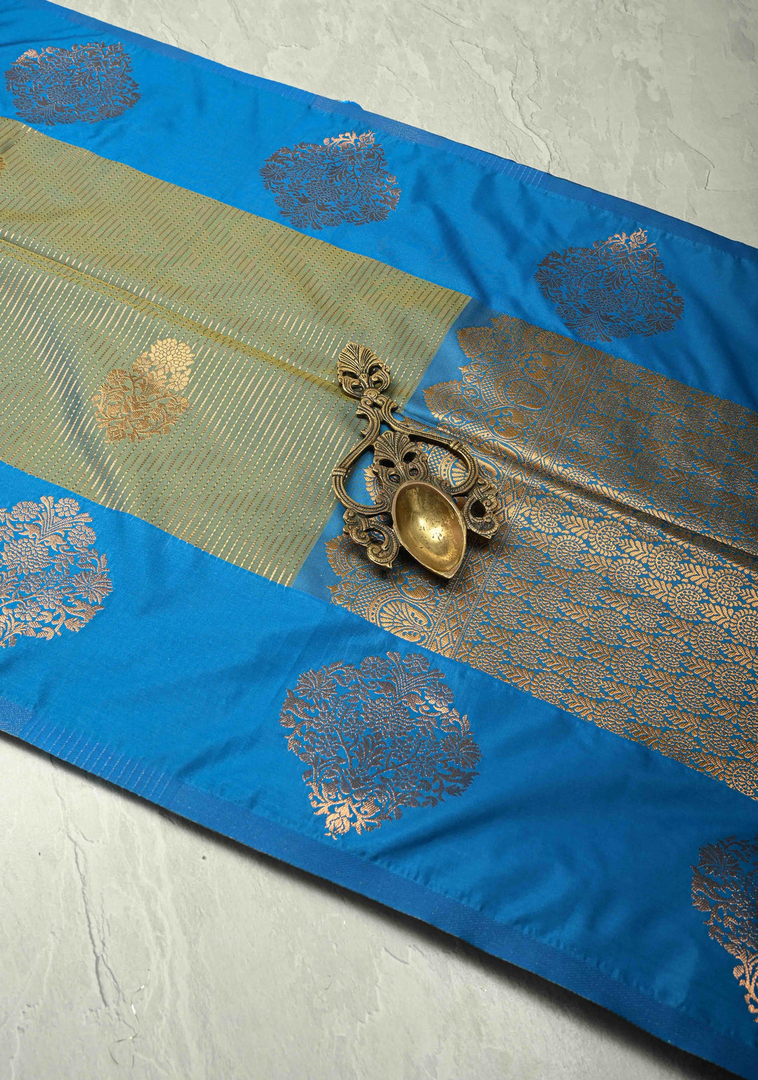 Sage Green-Blue Dual tone Vertical Zari Stripes on Kanchi Semi Silk Saree with Floral Buttas and Distinct Motifs on Contrast Border