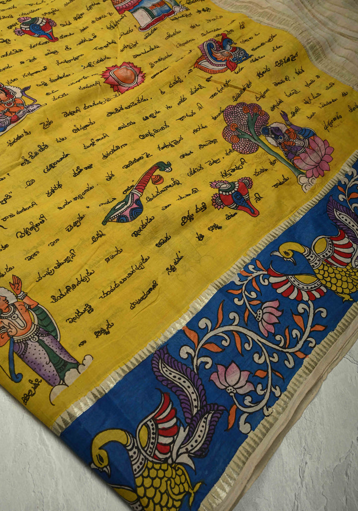 Telugu Script and Motiifs Theme : Yellow Authentic Pen Kalamkari Handpainted on Pure Mangalagiri Silk Cotton Saree with Contrast Border | SHOBITAM