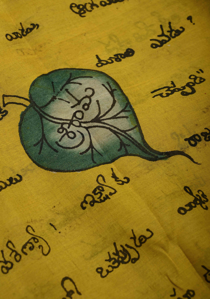 Telugu Script and Motiifs Theme : Yellow Authentic Pen Kalamkari Handpainted on Pure Mangalagiri Silk Cotton Saree with Contrast Border | SHOBITAM
