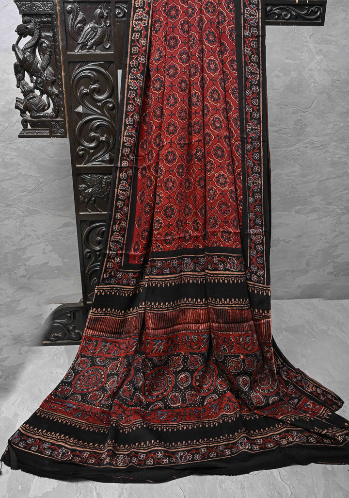 Brick Red Ajrakh hand Block Prints on Modal Silk Saree with Floral Hand Block Print