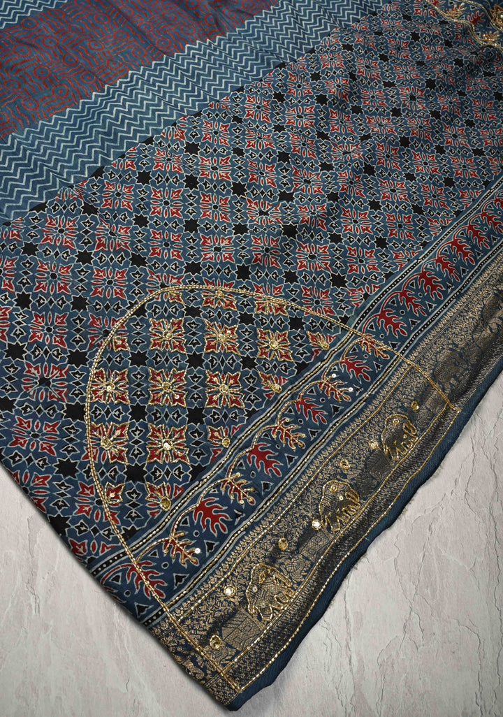 Indigo Ajrakh Hand Block Print on Dola Silk Saree with Cutdana-Sequins Work and Fancy Zari Border