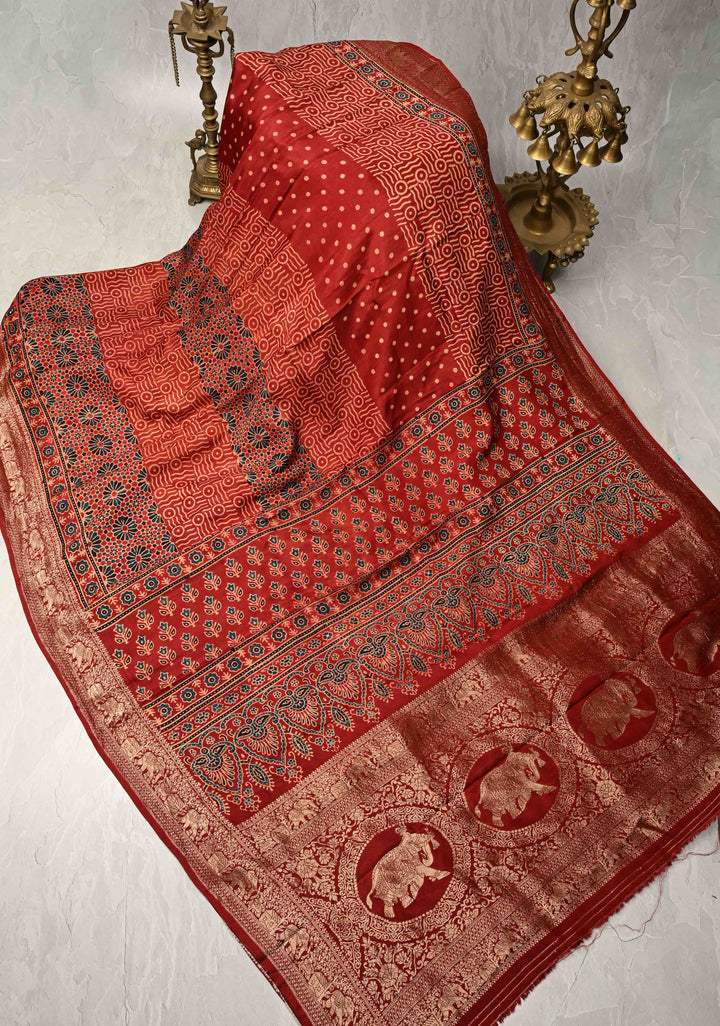 Deep Red Ajrakh Hand Block Print on Dola Silk Saree with Fancy Zari Border