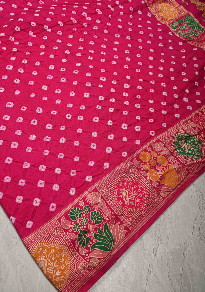Fuchsia Pink Crushed Bandhini on Art Silk Saree with Meenakari Zari Border and Village Theme Pallu
