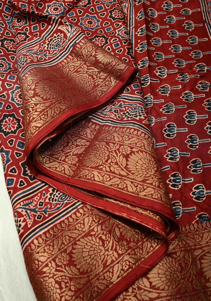 Brick Red Dola Silk Saree with Ajrakh Hand Block Print and Fancy Zari Border