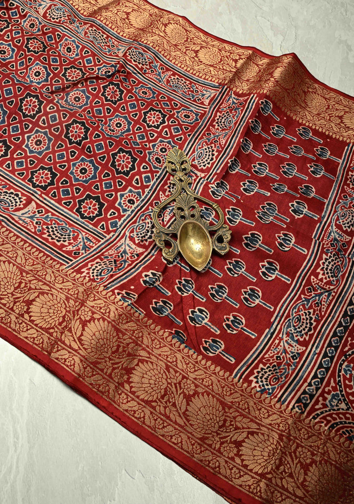Brick Red Dola Silk Saree with Ajrakh Hand Block Print and Fancy Zari Border
