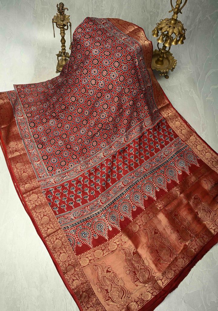 Brick Red Dola Silk Saree with Ajrakh Hand Block Print and Fancy Zari Border