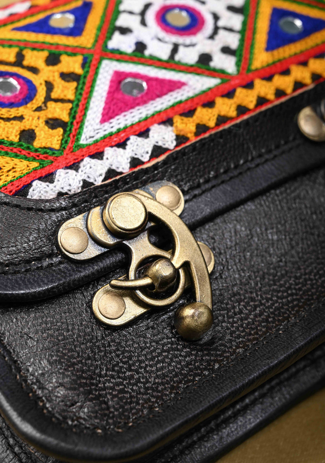 Leather Double Buckle Black Sling Bag With Hand-Crafted And Embroidery