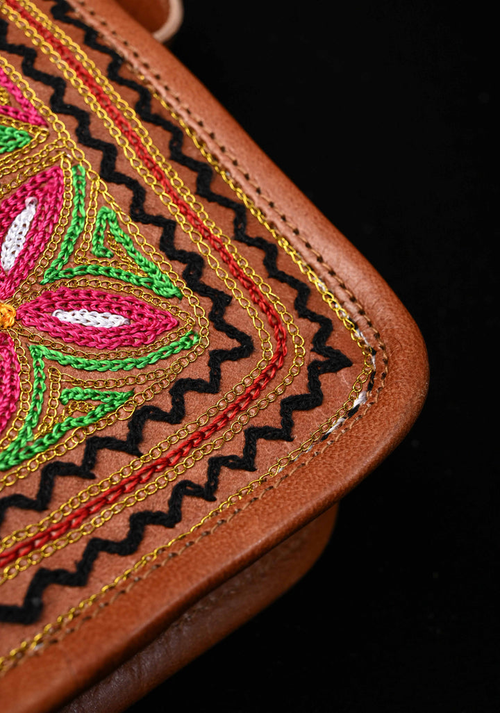 Brown Leather Double Buckle Sling Bag With Hand-Crafted And Floral Embroidery