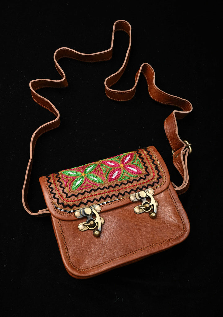 Brown Leather Double Buckle Sling Bag With Hand-Crafted And Floral Embroidery