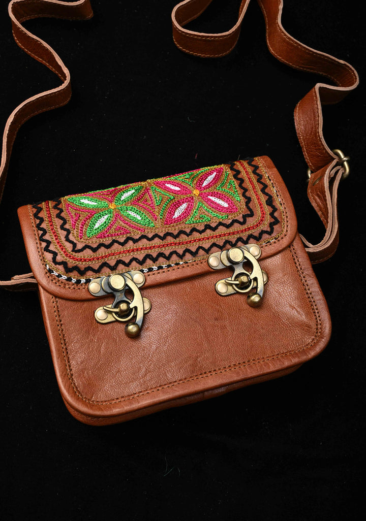 Brown Leather Double Buckle Sling Bag With Hand-Crafted And Floral Embroidery