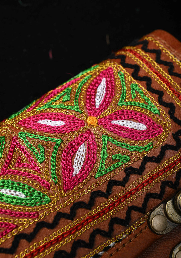 Brown Leather Double Buckle Sling Bag With Hand-Crafted And Floral Embroidery