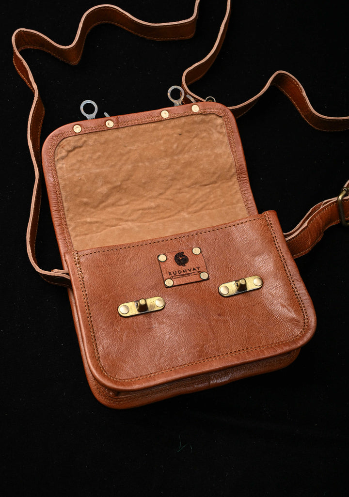 Brown Leather Double Buckle Sling Bag With Hand-Crafted And Floral Embroidery