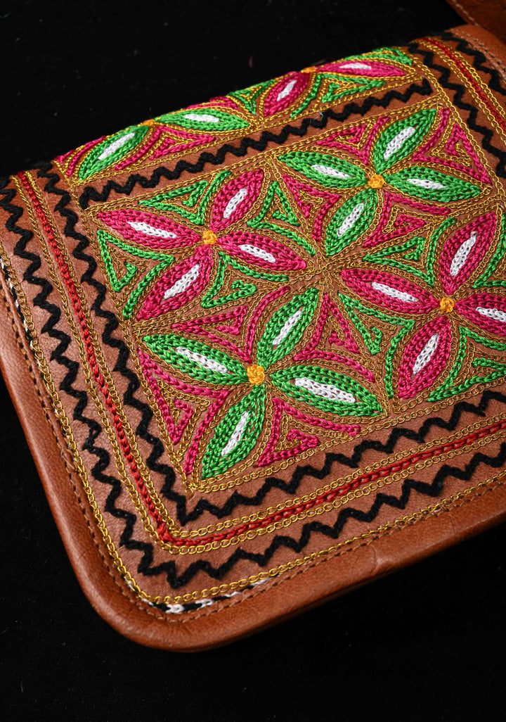 Brown Leather Double Buckle Sling Bag With Hand-Crafted And Floral Embroidery