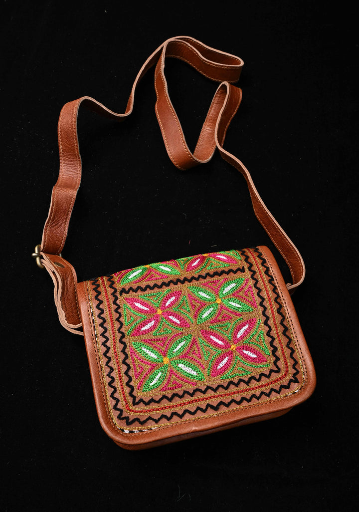 Brown Leather Double Buckle Sling Bag With Hand-Crafted And Floral Embroidery
