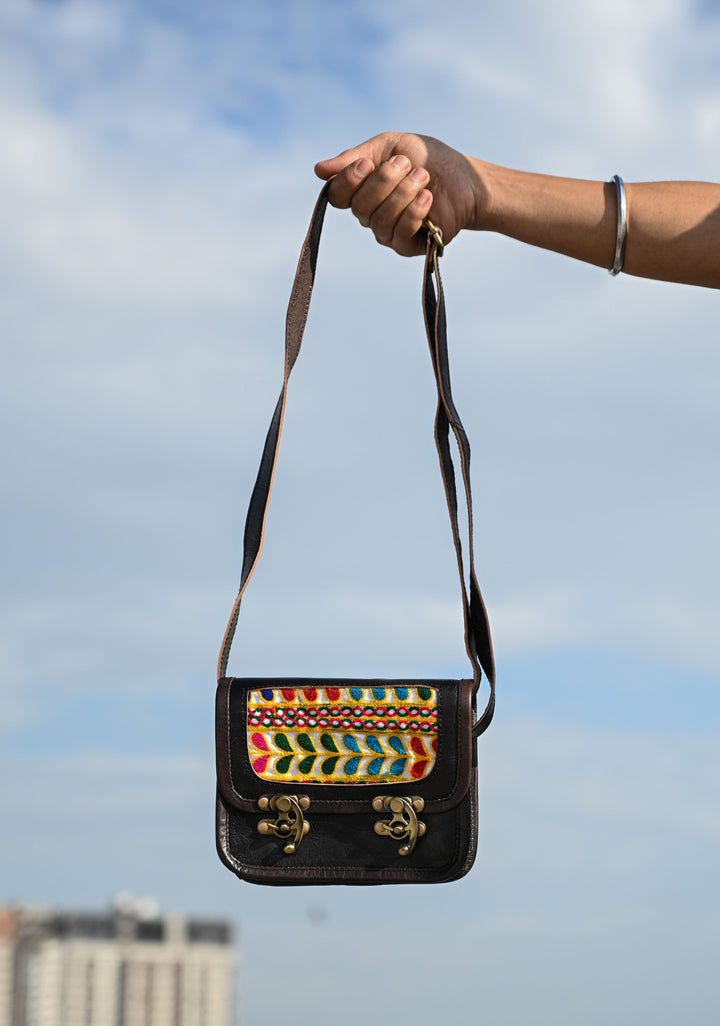 Black Leather Double Buckle Sling Bag With Hand-Crafted And Leaf Embroidery