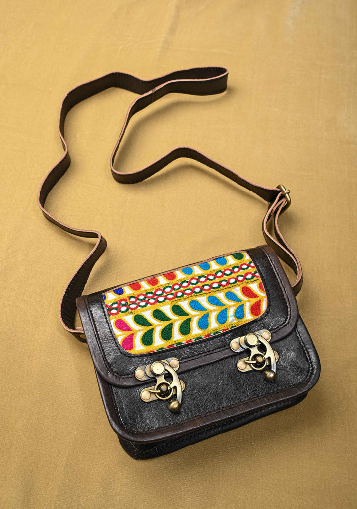 Black Leather Double Buckle Sling Bag With Hand-Crafted And Leaf Embroidery