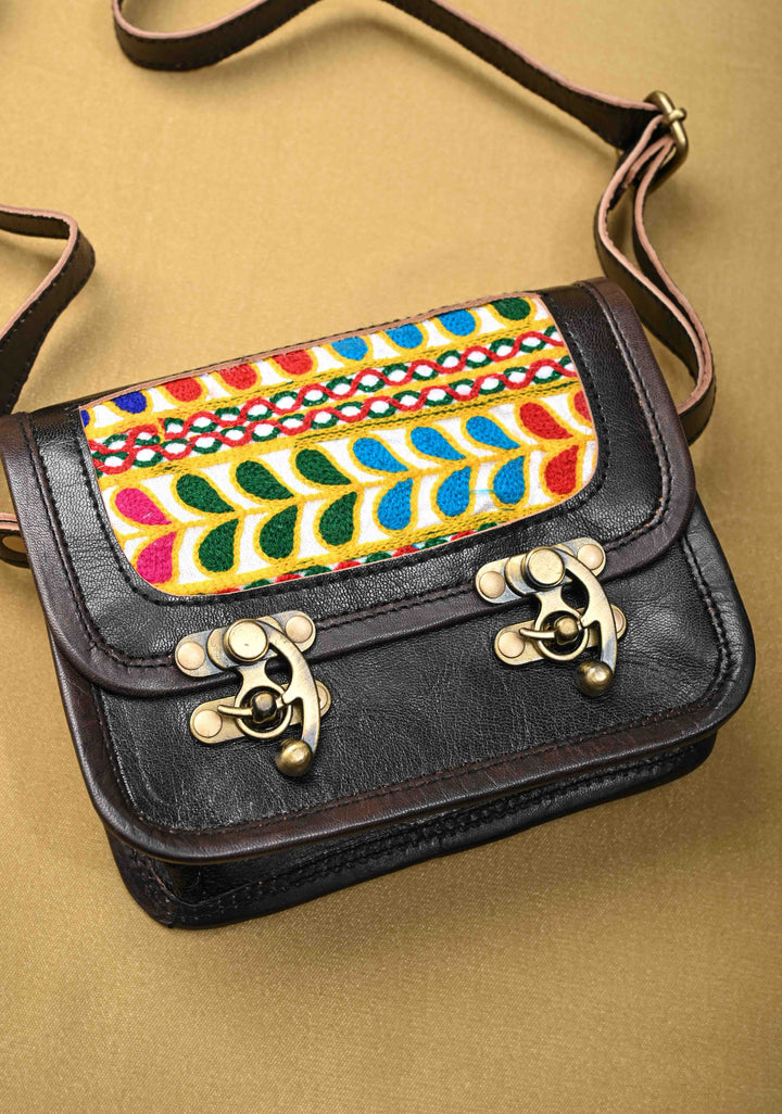 Black Leather Double Buckle Sling Bag With Hand-Crafted And Leaf Embroidery