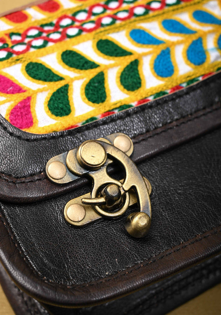 Black Leather Double Buckle Sling Bag With Hand-Crafted And Leaf Embroidery