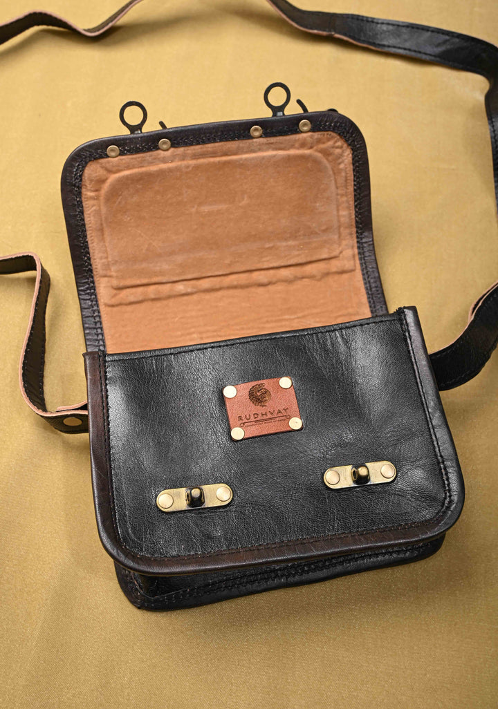 Black Leather Double Buckle Sling Bag With Hand-Crafted And Leaf Embroidery