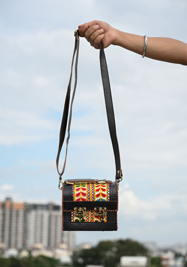Black Leather Double Buckle Hut Bag With Hand-Crafted And Leaf Embroidery