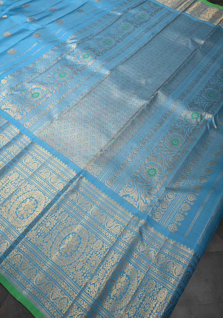 Chlorine Blue Gadwal Silk Saree With Horizontal Zari Stripes, Zari Buttas And Wide Floral Zari Border | SILK MARK CERTIFIED