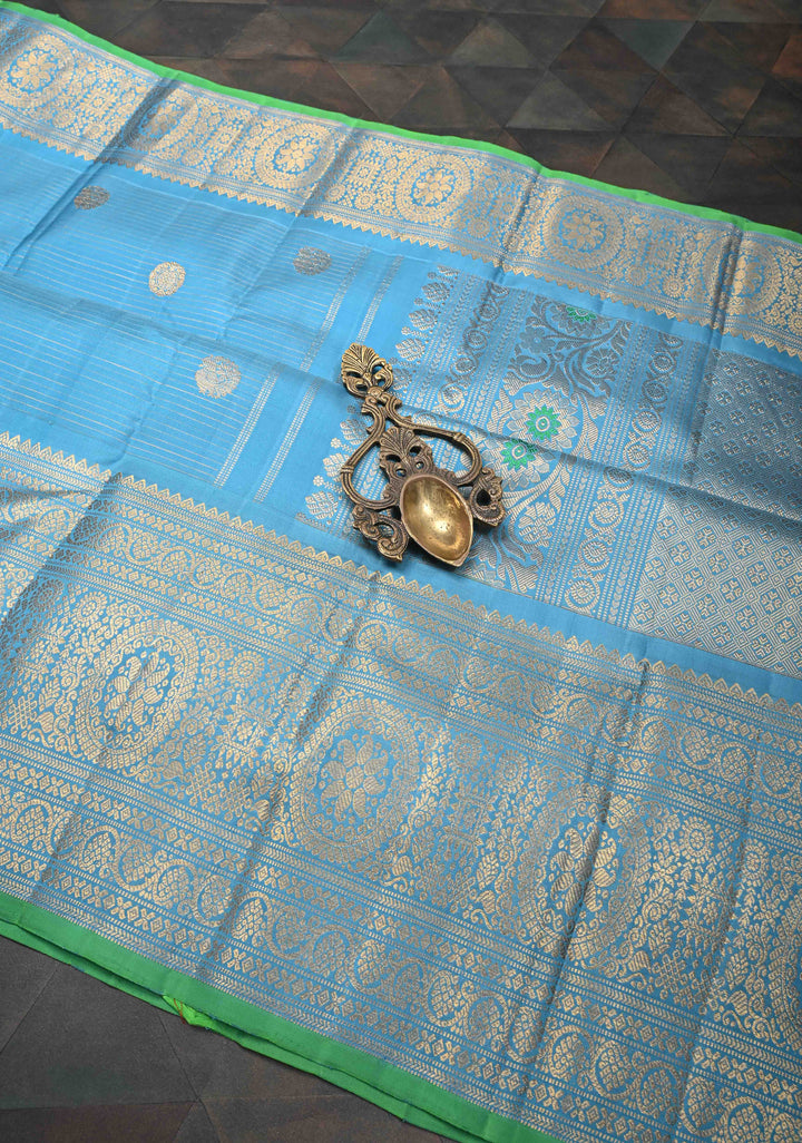 Chlorine Blue Gadwal Silk Saree With Horizontal Zari Stripes, Zari Buttas And Wide Floral Zari Border | SILK MARK CERTIFIED